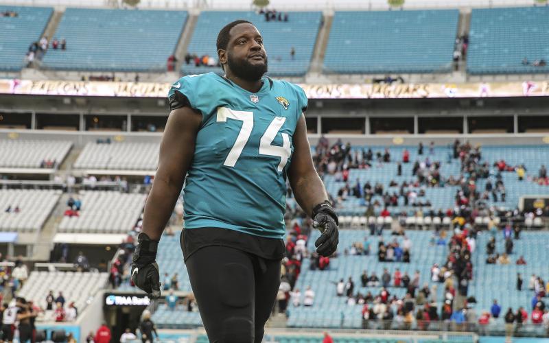 Jacksonville Jaguars offensive tackle Cam Robinson (74) walks off the field after a game against the Atlanta Falcons on Nov. 28, 2021, in Jacksonville. (GARY MCCULLOUGH/AP File)