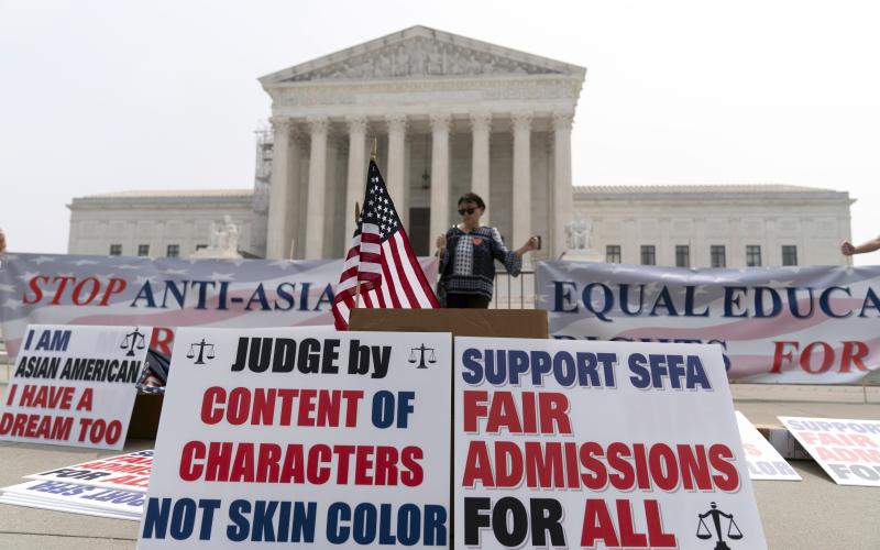 A person protests outside of the Supreme Court in Washington on Thursday. (JOSE LUIS MAGANA/Associated Press)