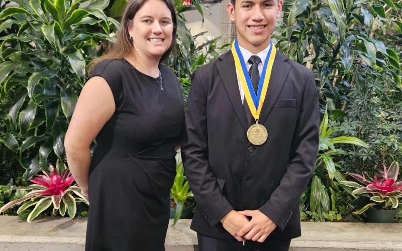 Lafayette eighth-grader Fhelix Hernandez, pictured with LHS FBLA Advisor Toni Sherrell, finished second at the FBLA National Conference in the ‘Running an Effective Meeting’ test. (COURTESY)