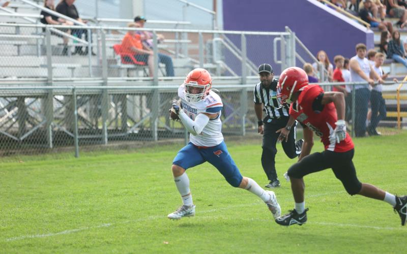 Branford wide receiver Austin Malaguti races past a Hamilton County defender for a touchdown during the teams’ spring jamboree at Bell. (PAUL BUCHANAN/Special to the Reporter)