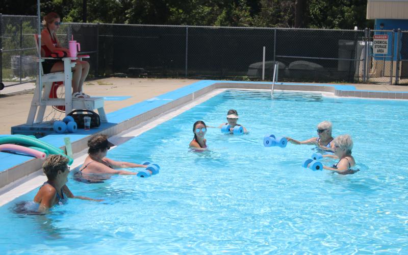 Lifeguard Rachel Douberley leads a water aerobics class at the Jared Allison Aquatic Complex. (TONY BRITT/Lake City Reporter)