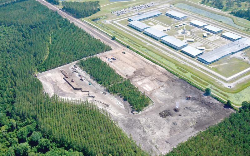 Wharton-Smith is constructing the wastewater treatment plant for the North Florida Mega Industrial Park. Lake City and Columbia County officials are working through a ‘misunderstanding’ over who will provide water at the facility. (COURTESY AERO PHOTO)