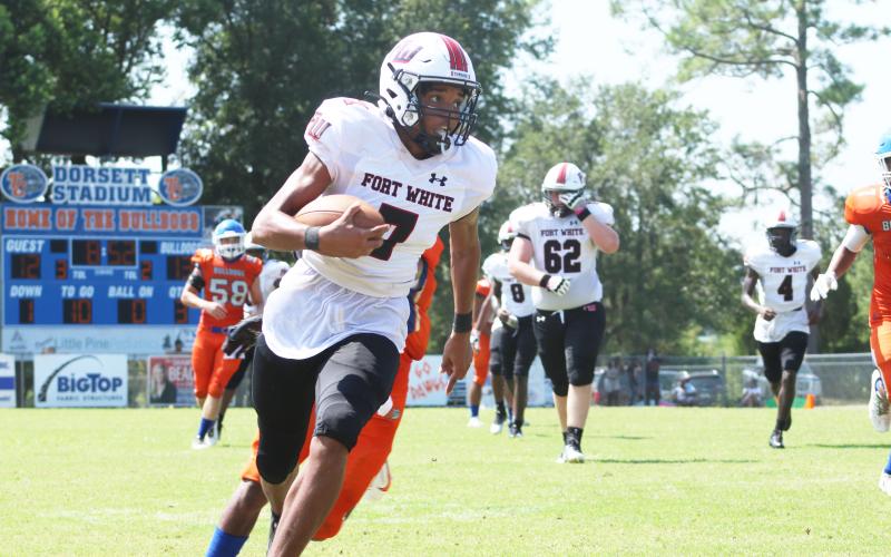 Fort White receiver Tafari Moe runs up the field after a catch against Taylor County on Saturday. (JAMIE WACHTER/Lake City Reporter)