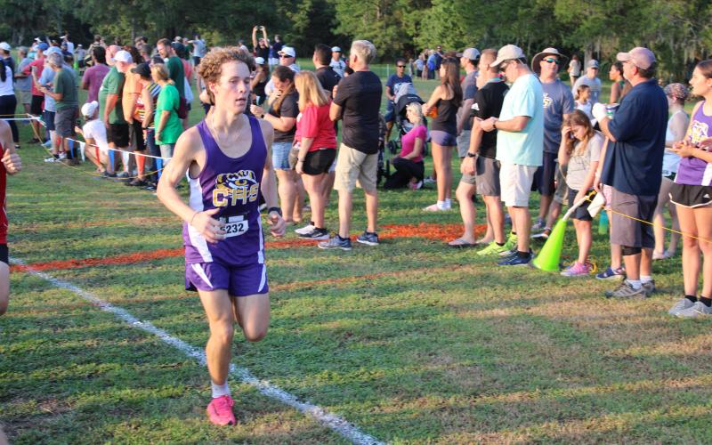 Columbia's Nathan Matsubara runs at the Cecil Field Summer Classic on Friday. (COURTESY)