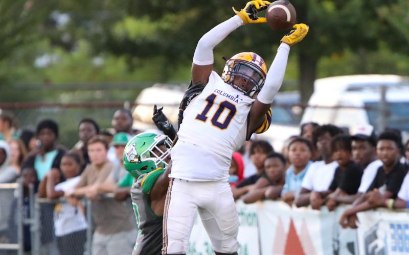 Columbia receiver Zamarion Jones jumps to catch a touchdown pass in the back of the end zone against Suwannee during Friday’s Preseason Classic. (BRENT KUYKENDALL/Lake City Reporter)