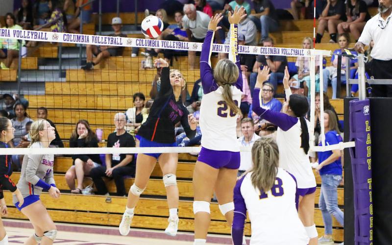 Branford’s Jadyn Mosley returns a shot against Columbia on Tuesday night. (BRENT KUYKENDALL/Lake City Reporter)