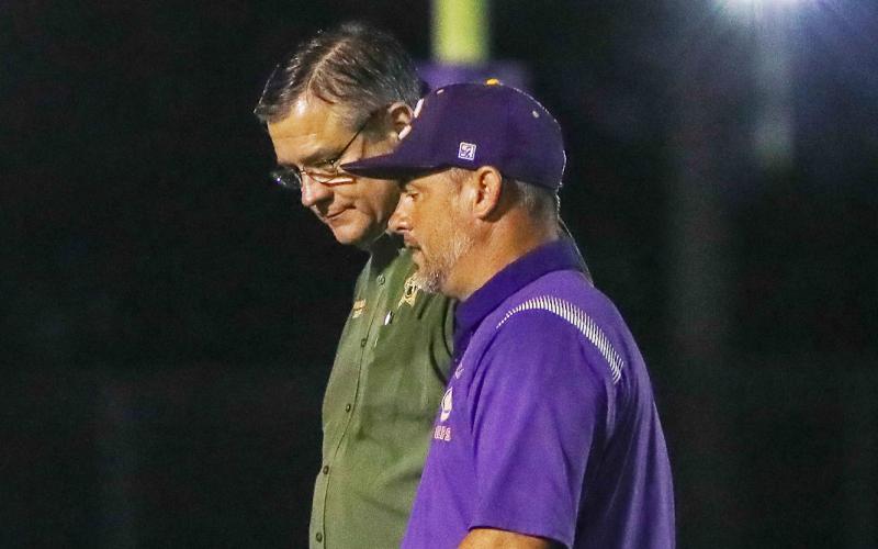 Columbia County Sheriff Mark Hunter walks with Columbia High School principal Trey Hosford at Tiger Stadium on Friday night. (BRENT KUYKENDALL/Lake City Reporter)