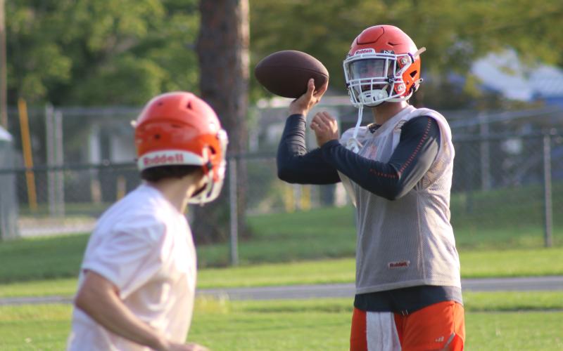 Branford quarterback Thomas Sikes throws a pass during Monday’s practice. (JAMIE WACHTER/Lake City Reporter)