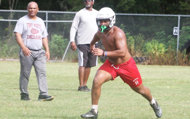 Fort White linebacker Lecosta Byrd runs to make a tackle during Monday’s practice. (MORGAN MCMULLEN/Lake City Reporter)