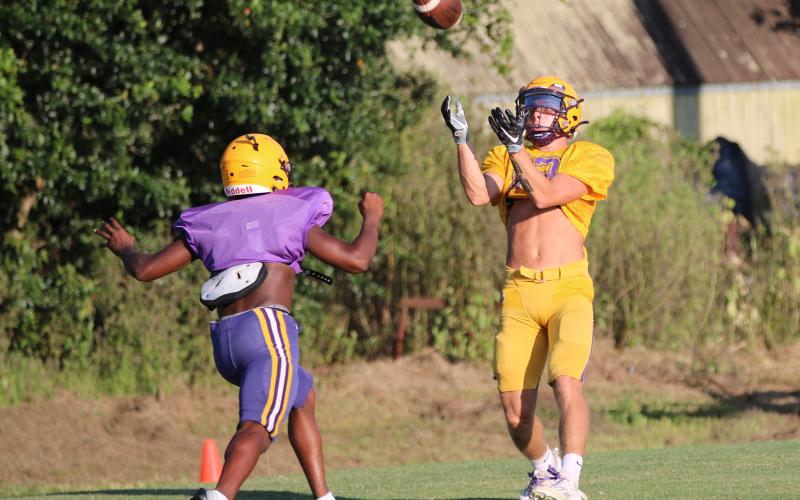 Columbia receiver Camdon Frier catches a touchdown pass during Monday’s practice. (JORDAN KROEGER/Lake City Reporter)