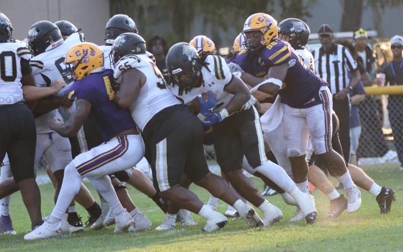 Buchholz running back Myles Graham pushes across the goal line for a touchdown against Columbia on 4th-and-goal Saturday night. (JORDAN KROEGER/Lake City Reporter)