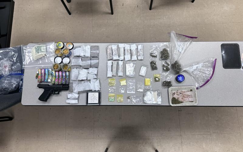 A traffic stop Saturday led to two arrests after Lake City police officers found a variety of narcotics and a firearm in the vehicle. (COURTESY LCPD)