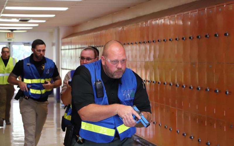 First responders walk through the halls of Columbia High School during an active shooter training this week. (COURTESY)