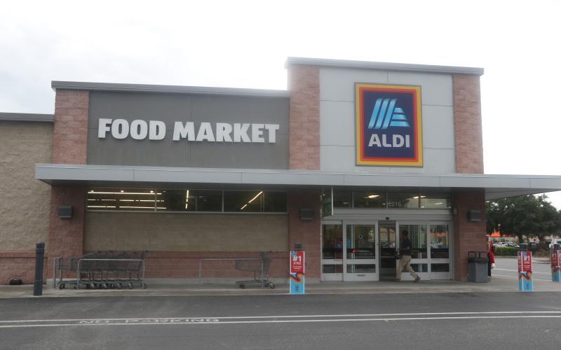 A shopper enters the Aldi store in Lake City on Wednesday afternoon. The Germany-based company announced Wednesday it plans to buy 400 Winn-Dixie and Harveys stores in the southeast. (MORGAN MCMULLEN/Lake City Reporter)