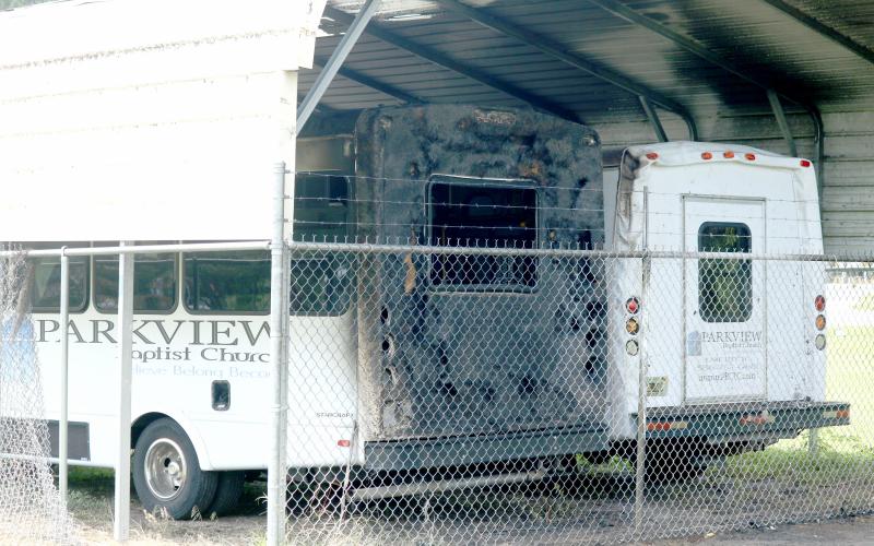 Parkview Baptist Church's two buses were damaged in a fire Wednesday night. (JAMIE WACHTER/Lake City Reporter)