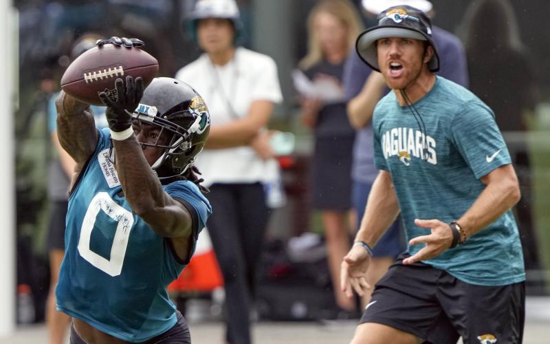 Jacksonville Jaguars wide receiver Calvin Ridley dives to make a catch during practice on Friday in Jacksonville. (JOHN RAOUX/Associated Press)