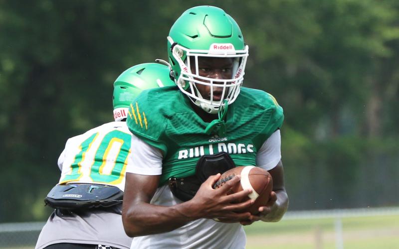 Suwannee receiver MJ Rossin runs up the field after a catch during Friday’s practice. (JAMIE WACHTER/Lake City Reporter)