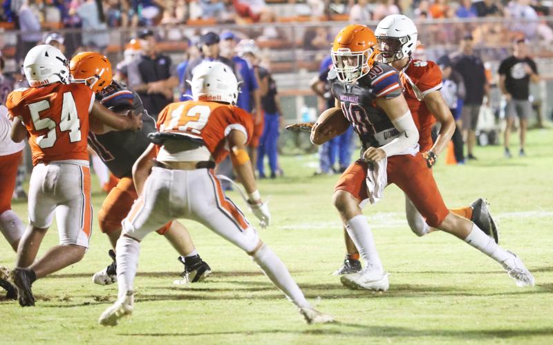 Branford quarterback scrambles up the field against Trenton during last Friday’s jamboree. (PAUL BUCHANAN/Special to the Reporter)