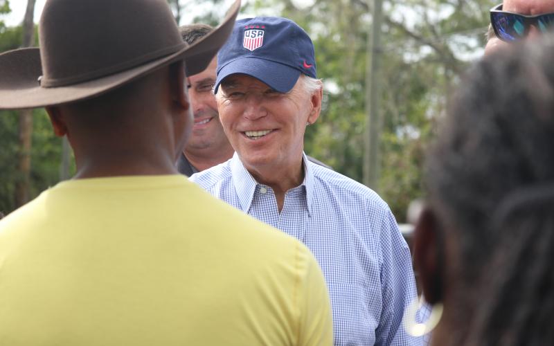 President Joe Biden visits with Gary Caldwell, a Live Oak resident, during a visit Saturday to assess the damages from Hurricane Idalia. (JAMIE WACHTER/Lake City Reporter)