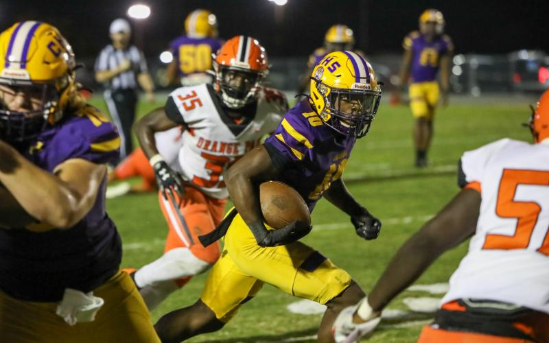 Columbia receiver Zamarion Jones runs up the field after a catch against Orange Park on Friday. Jones caught one of five touchdown passes from freshman quarterback Xavier Collins. (BRENT KUYKENDALL/Lake City Reporter)