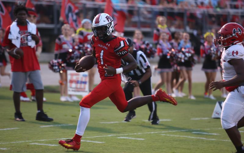 Fort White running back Dakota Fisher heads to the end zone on one of his three touchdowns Friday night against Hamilton County. (PAUL BUCHANAN/Special to the Reporter)