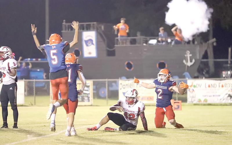 Branford players celebrate after running back Trevor Maddox scored the go-ahead touchdown with 15 seconds left Friday night to lift the Bucs past Hilliard. (ERIN ROBERTS/Special to the Reporter)