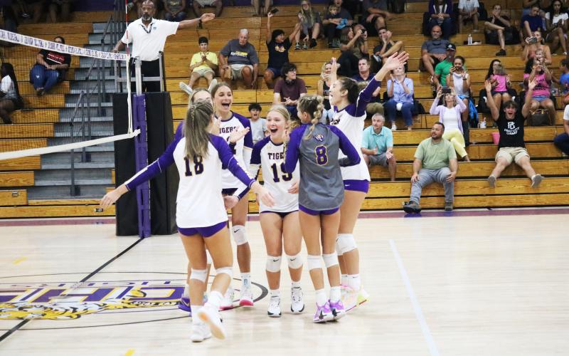 Columbia celebrates after scoring the final point to sweep Bradford on Thursday night. (JORDAN KROEGER/Lake City Reporter)
