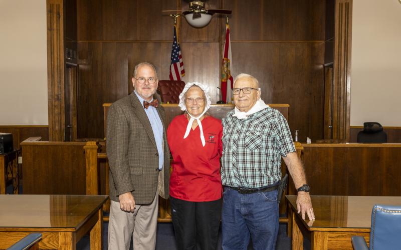 Lafayette County Judge Darren K. Jackson with Gloria and Allen Johnson after swearing the couple in as the 2022 Lafayette County Chamber of Commerce Pioneer Day Granny and Pappy last year at the Lafayette County Courthouse. Voting for this year’s Granny and Pappy begins today. (FILE)