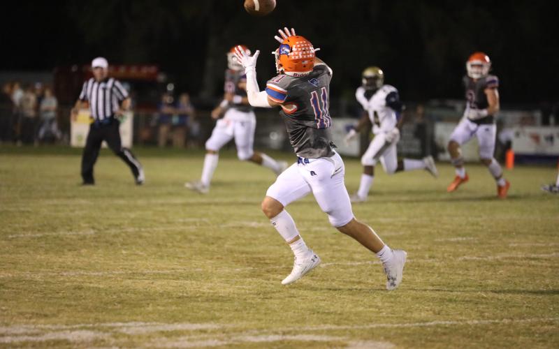 Branford wide receiver Austin Malaguti hauls in a pass Friday night against Paxon. (ERIN ROBERTS/Special to the Reporter)