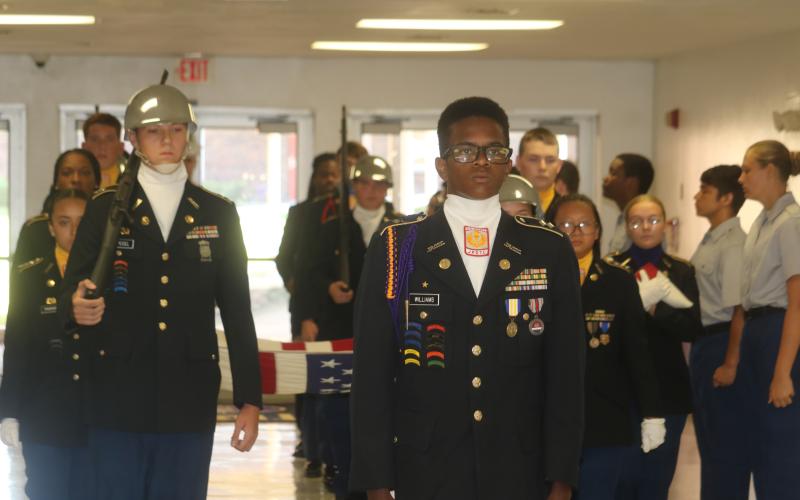 Titus Williams, the Columbia High JROTC Battalion Commander, leads the flag-bearing procession during Monday’s 9/11 memorial march at the school. (TONY BRITT/Lake City Reporter)