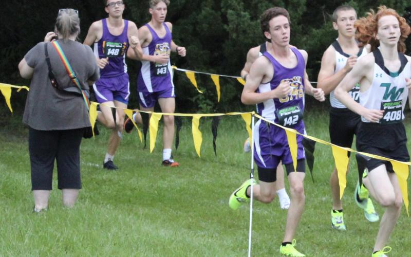Columbia runner Nolan Martin is followed closely by teammates Nathan Matsubara and Joshua Thompson at the Bobcat Classic on Saturday. (COURTESY)