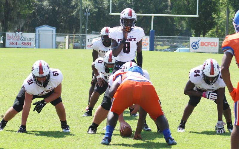 Fort White quarterback Jayden Jackson gets set for the snap against Taylor County on Aug. 26. (JAMIE WACHTER/Lake City Reporter)