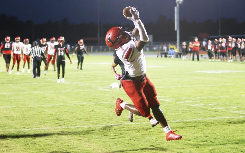 Lafayette receiver Jalen Hill catches a touchdown pass against Hamilton County last Friday. (PAUL BUCHANAN/Special to the Reporter)