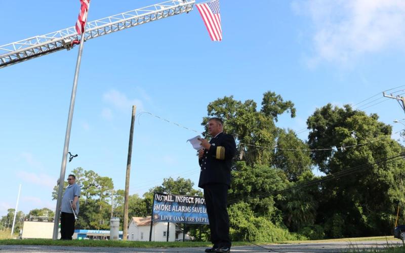 Former Live Oak Fire Chief Chad Croft reads off information about one of the attacks on Sept. 11, 2001, during a previous year’s Patriot Day ceremony. (SUWANNEE DEMOCRAT FILE)