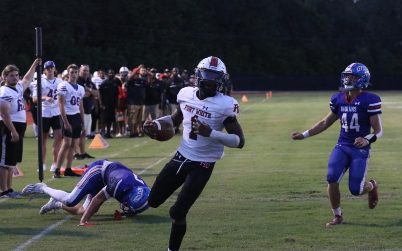 Fort White running back Dakota Fisher takes in a rushing touchdown Friday at Keystone Heights. (MORGAN MCMULLEN/Lake City Reporter)