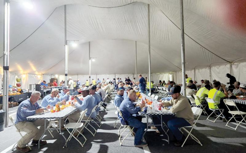 Linemen eat in the dining tent at the base camp at Suwannee Valley Electric Cooperative. Currently, more than 800 workers are being fed daily at the base camp on the co-op’s campus. (COURTESY SUWANNEE VALLEY ELECTRIC COOPERATIVE)