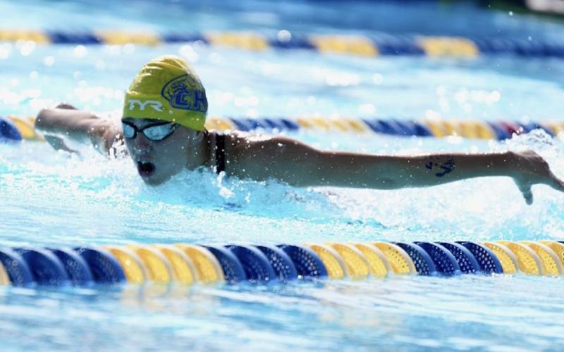 Columbia swimmer Casey Fair competes in the 100 butterfly at the District 2-3A meet on Oct. 23. (COURTESY)
