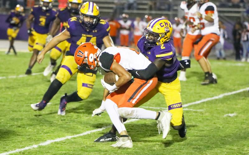 Columbia defensive back D’Mari Bruce tackles Orange Park receiver Ryder Fulmer on Friday night. (BRENT KUYKENDALL/Lake City Reporter)