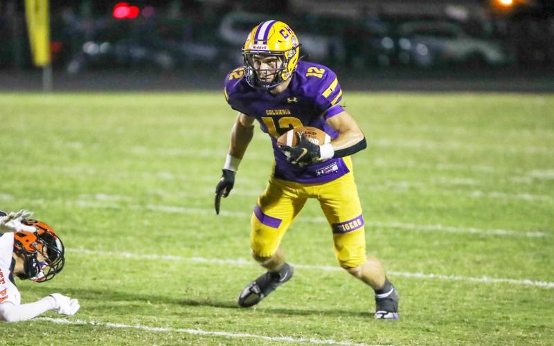 Columbia receiver Camdon Frier turns up the field after a catch against Orange Park on Friday night. (BRENT KUYKENDALL/Lake City Reporter)