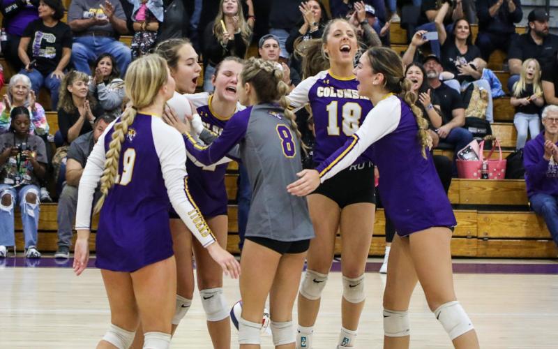 Columbia players celebrate after a point against Vanguard during the District 2-5A semifinals on Tuesday. (BRENT KUYKENDALL/Lake City Reporter)