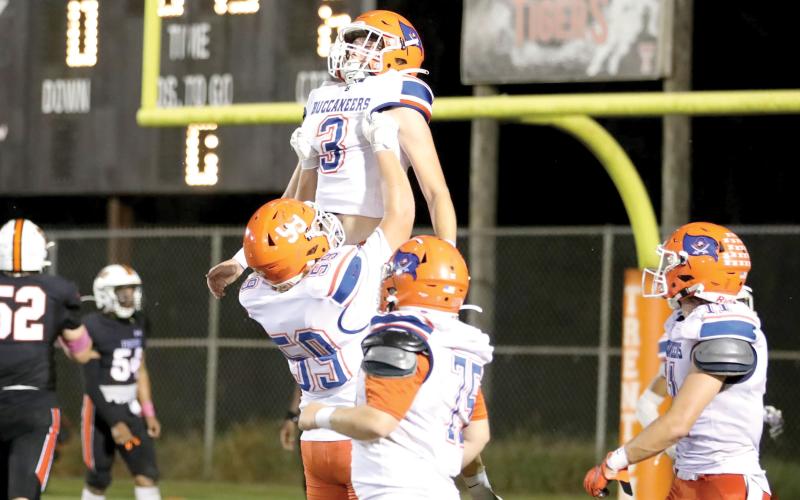 Branford wide receiver Haiden Ward and offensive lineman Sabastian Waugama celebrate after Ward’s touchdown in the second quarter Friday against Trenton. (ERIN ROBERTS/Special to the Reporter)