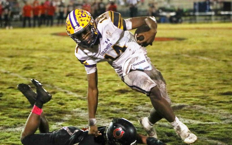 Columbia quarterback Xavier Collins scrambles past a Middleburg defender on Oct. 13. (BRENT KUYKENDALL/Lake City Reporter)