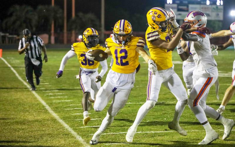 Columbia receiver Camdon Frier (12) tip-toes the sideline after a catch against Bolles on Friday. (BRENT KUYKENDALL/Lake City Reporter)
