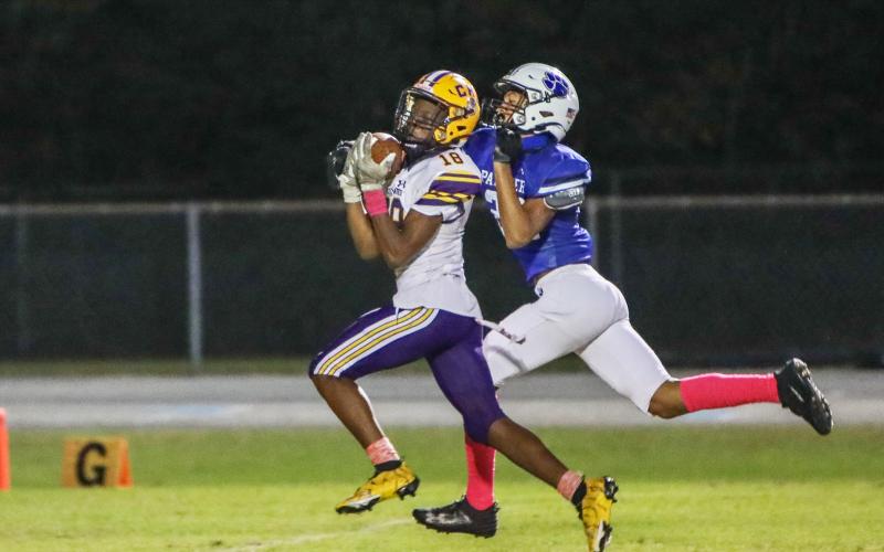 Columbia receiver Marlin Haywood catches a touchdown pass against Ridgeview on Friday night. (BRENT KUYKENDALL/Lake City Reporter)