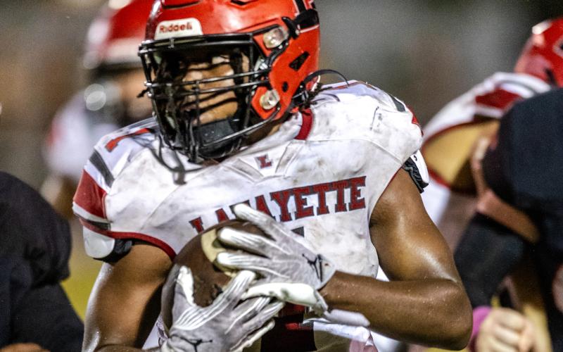Lafayette linebacker Jalen Hill returns an interception for a touchdown against Trenton on Friday. (JACK HOWDESHELL/Special to the Reporter)