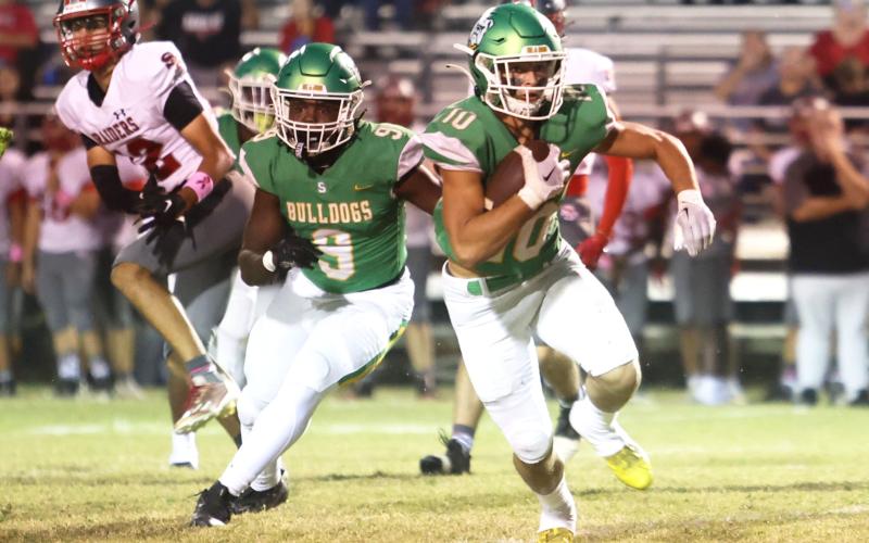 Suwannee safety Kodi Lang returns an interception in the first quarter Friday against Santa Fe. (PAUL BUCHANAN/Special to the Reporter)