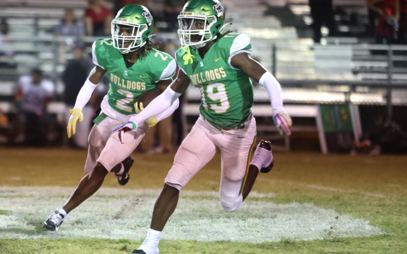 Suwannee defensive back Amarion Rojas (2) returns a kickoff as defensive back Jadarius Horne (19) blocks against Santa Fe last Friday. (PAUL BUCHANAN/Special to the Reporter)