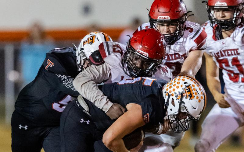 Lafayette safety Blake Pilkington makes a tackle against Trenton last Friday. (JACK HOWDESHELL/Special to the Reporter)
