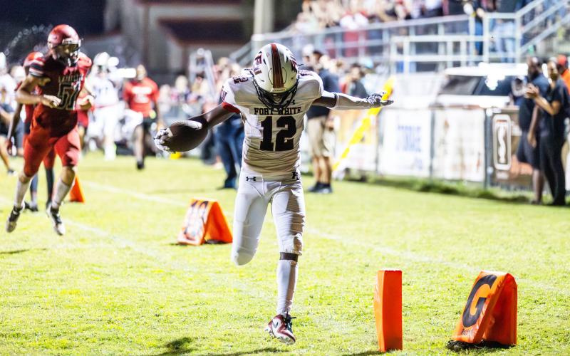 Fort White wide receiver Najeeb Smith celebrates as he crosses the goal line for a touchdown Friday night against Lafayette. (JACK HOWDESHELL/Special to the Reporter)