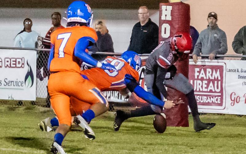Lafayette quarterback Tywan Williamson can’t track down a loose ball in the end zone, resulting in a safety for Taylor County on Tuesday. (JACK HOWDESHELL/Special to the Reporter)